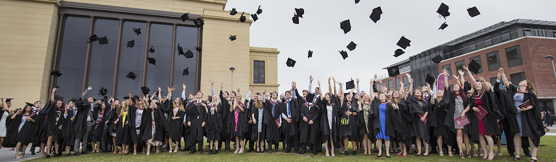 A crowd of graduates on the Bay Campus