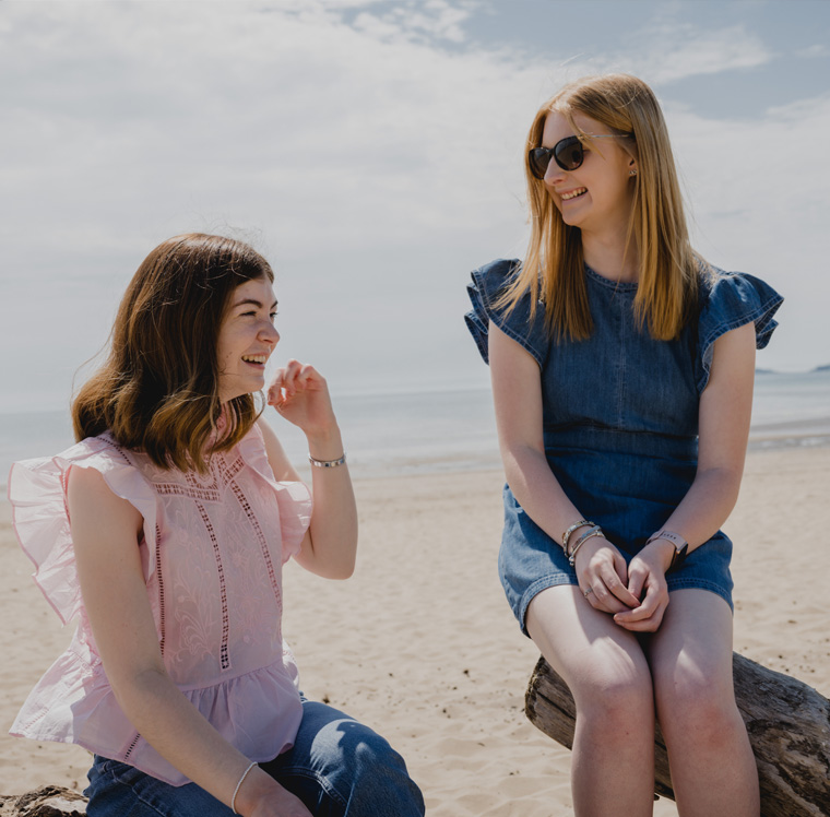 Students on the beach in Swansea