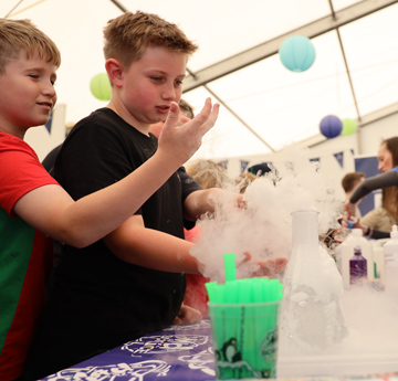 Children enjoying chemical experiments with Mad Science 
