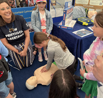 Dr Lauren Blake with the CPR doll