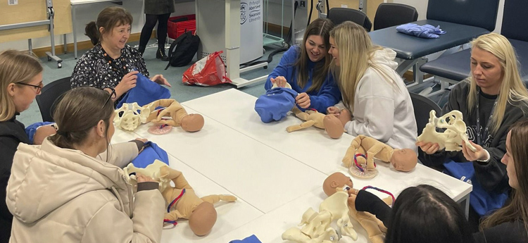 pupils get an insight into the Health Care courses available at Swansea through a practical session