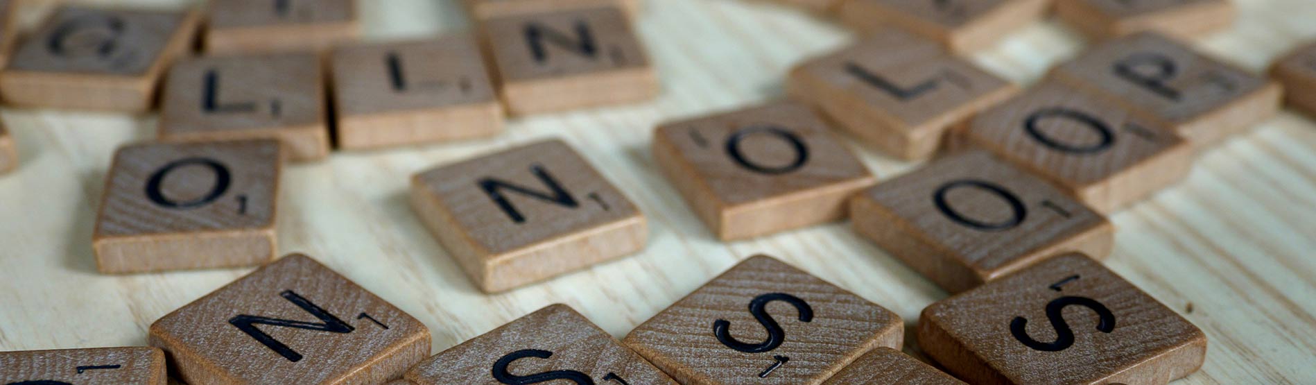 Scrabbles tiles scattered across a table.