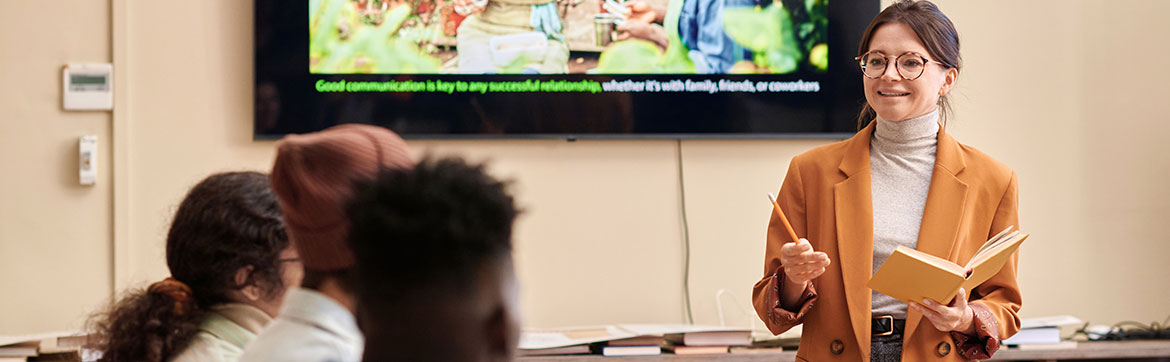 Presenter smiling at attendees