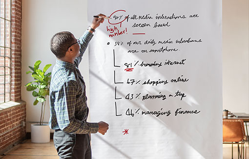 A man giving a poster presentation