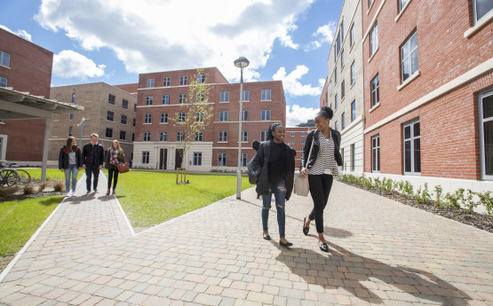 students walking across bay courtyard 