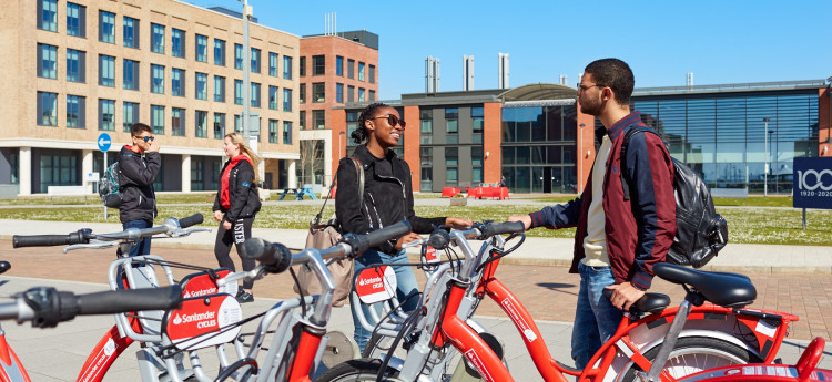 Students on Santander bikes in the Bay Campus