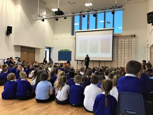 Eloise Williams giving a talk to some primary school children, as part of her role as Children's Laureate Wales.