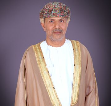 Gentleman in national dress looking at the camera