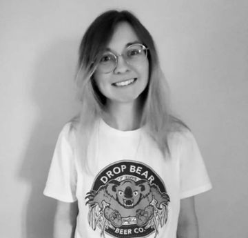 Lady wearing Drop Bear Beer t-shirt smiling at the camera