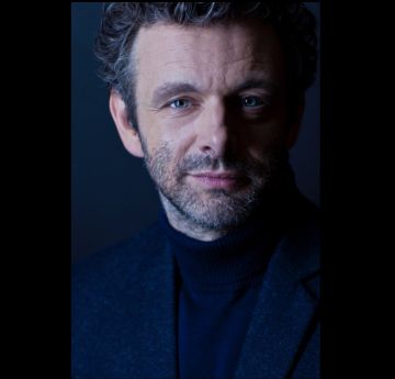 Head shot of a smartly dressed man looking directly into the camera.