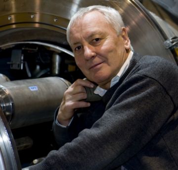 Man standing in front of a Large Hadron Collider
