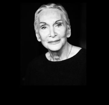 Headshot of a smartly dressed lady looking into the camera