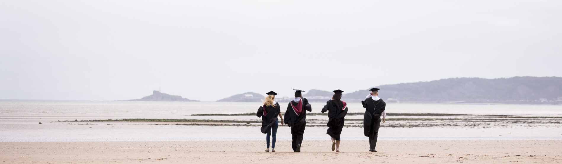 Graduates on beach