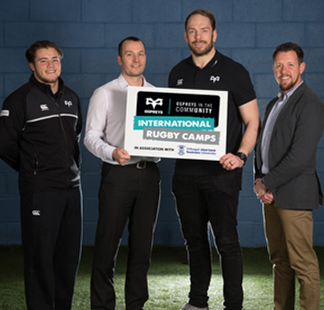 Alun Wyn Jones from the Ospreys rugby team with members of staff from Swansea University