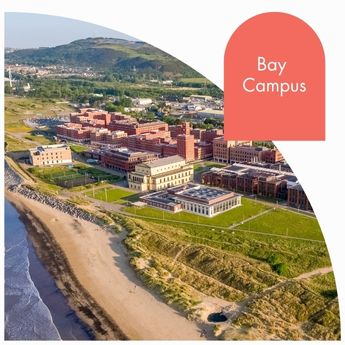 An aerial view of the buildings on Bay campus with a coral coloured arch