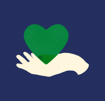 Hand holding green love heart