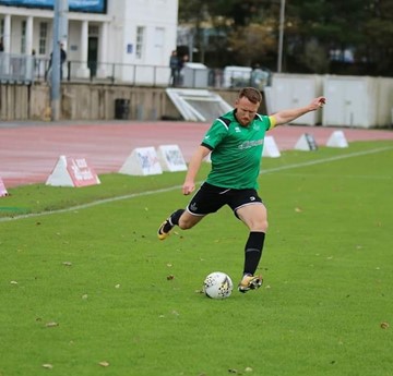 Dan Sheehan kicking a football