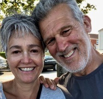 A close up photo of Jane and Tony smiling at the camera