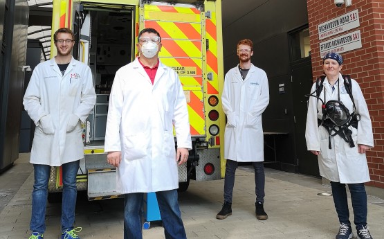 Ed Lester-Card, Dr Chedly Tizaoui, Anthony Lewis and Dr Karen Perkins of Swansea University College of Engineering, with the demonstration ambulance used to test out their speed-cleaning procedure