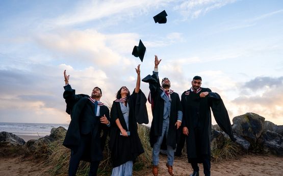Students throwing their cap at graduation