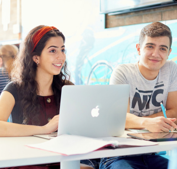 Students on laptop. 