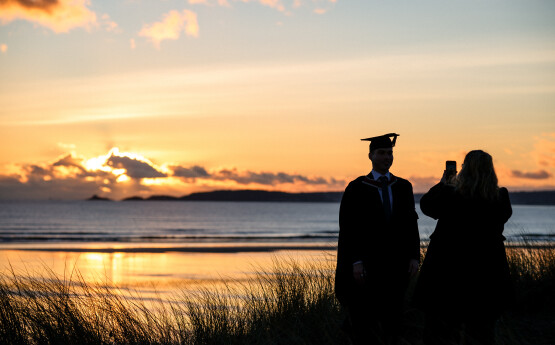 graduation sunset on beach