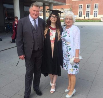 Geraint stands with his granddaughter and a woman as his granddaughter graduates on Bay campus. 
