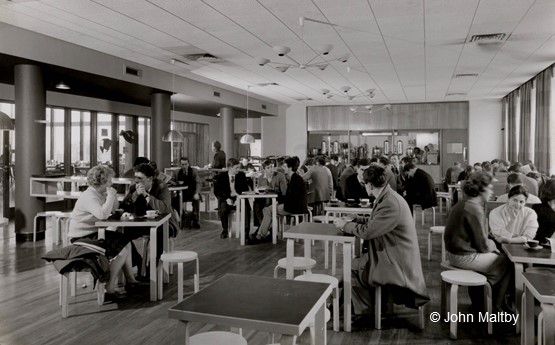 Students sat at tables in the common room in College House in the 1960s