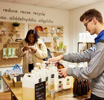 An image of students shopping at the zero waste outlet on campus