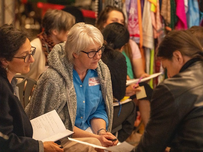 women talking at an event