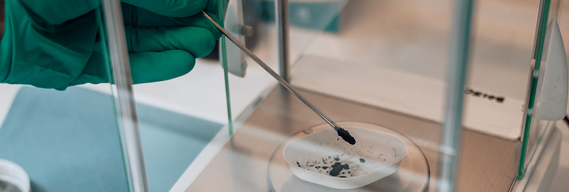 Researcher in a lab with petri dish