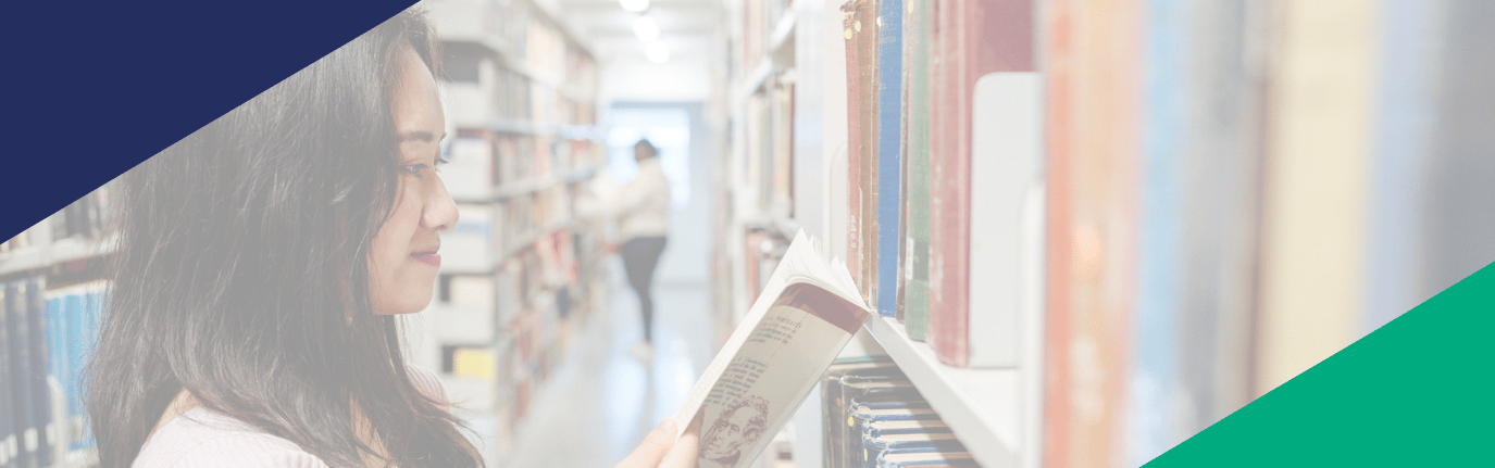 Students studying in Bay Library with geometric shapes on the graphic.