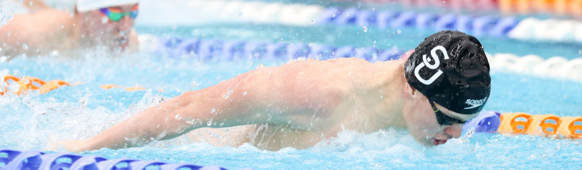 A Swansea University male swimmer doing butterfly