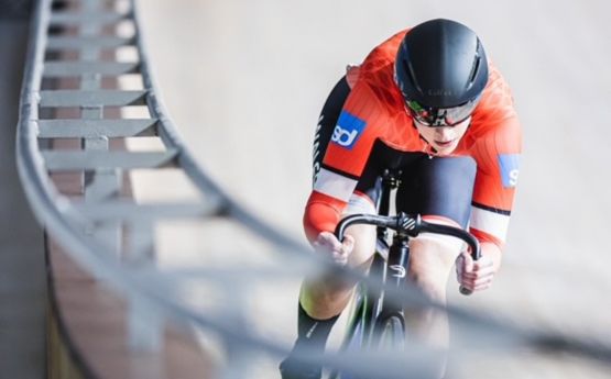 A Swansea University High Performance cyclist cycling on track at high speed