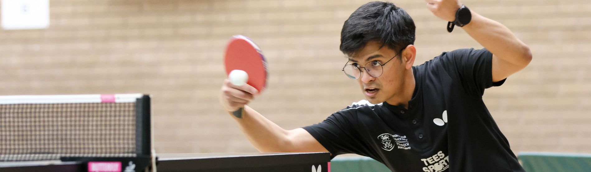 A high performing athlete at Swansea University playing table tennis