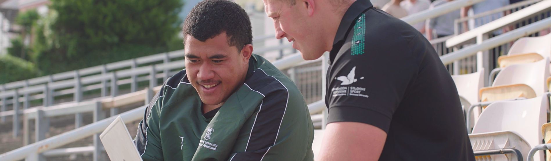 Athlete Support Officer Lloyd Ashley from Swansea University chatting to a high performance rugby scholar