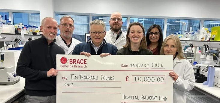 Group picture with cheque