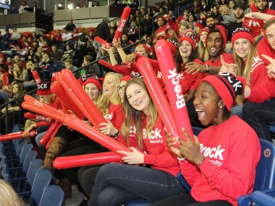 Students cheering in a stadium