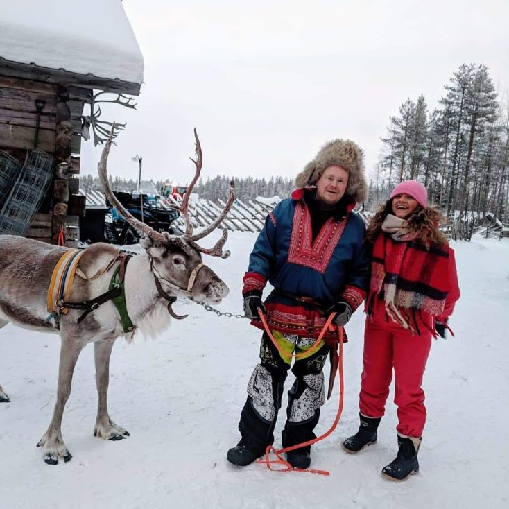 students with a reindeer