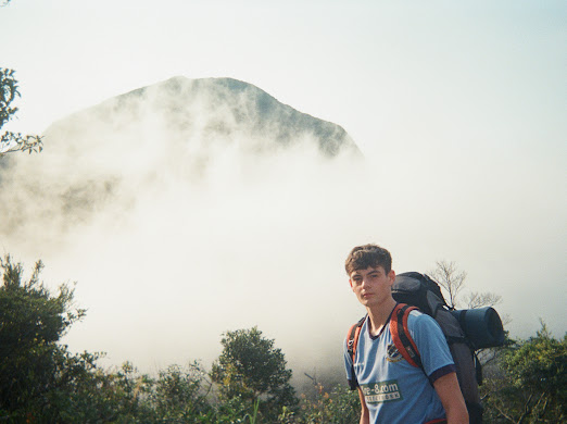 Student in Hong Kong surrounded by clouds.