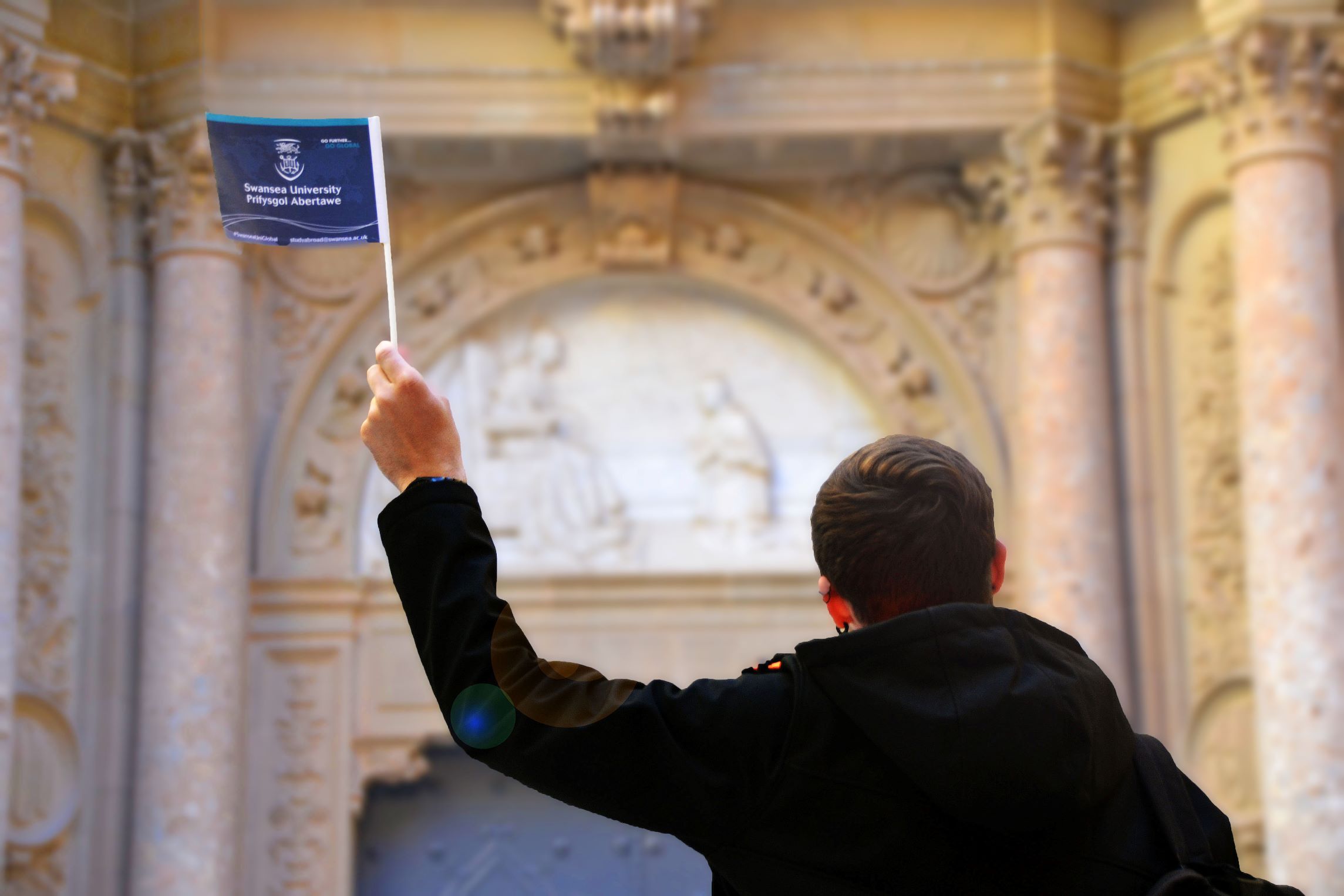 Student waving flag in Barcelona