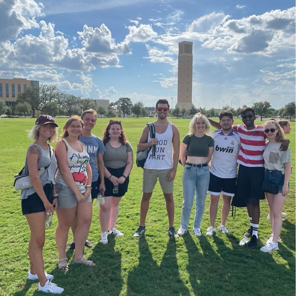 Group of students standing on lawn