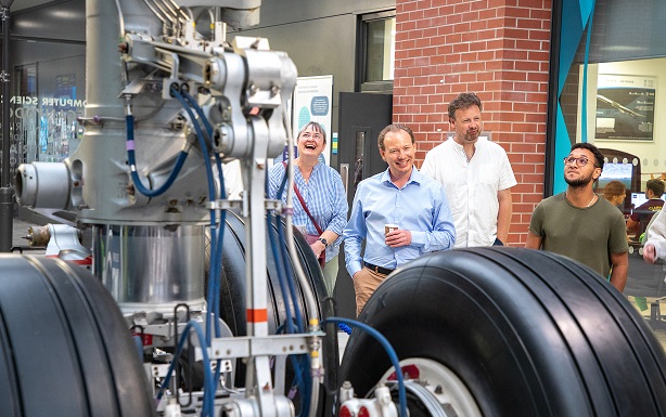 Researchers touring engineering facilities