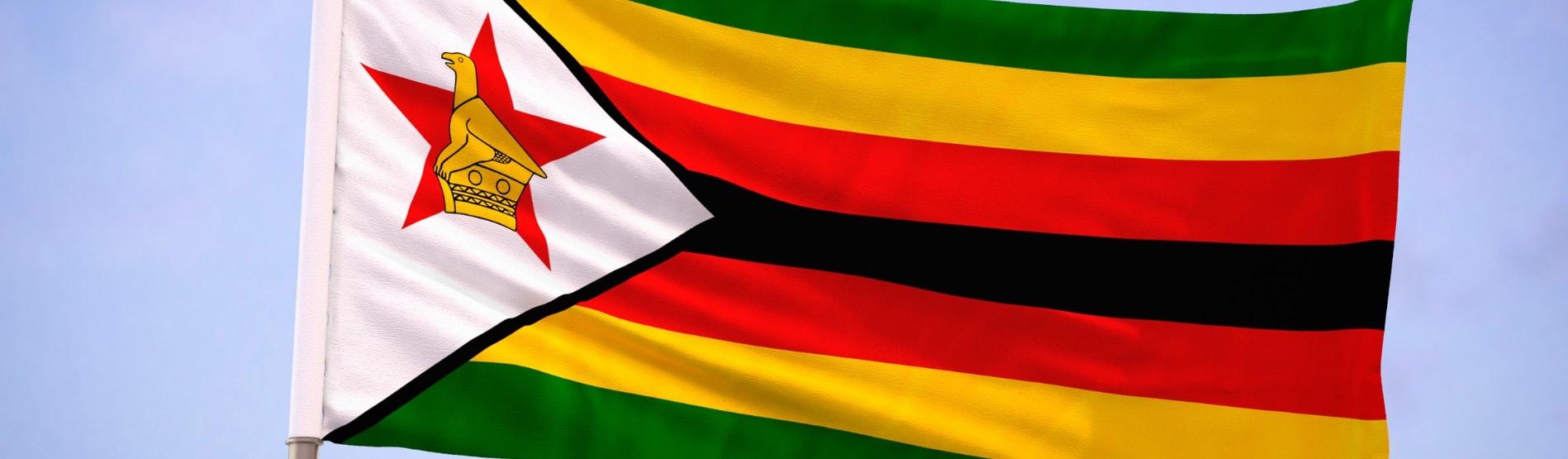 Zimbabwe flag blowing in the breeze.