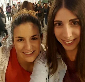 Image of student Eleni and her friend smiling into the camera