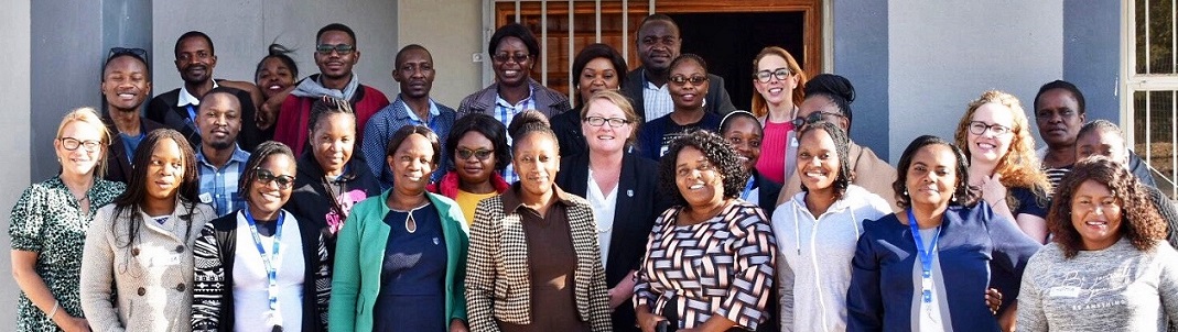 Group of students and Swansea academics outside Kafue skills centre, Zambia