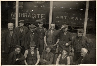 Photograph of colliery tram and workers