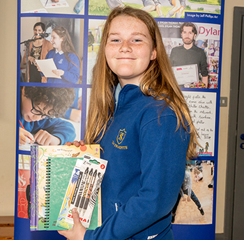Lewis Lewis holding her goody bag prizes