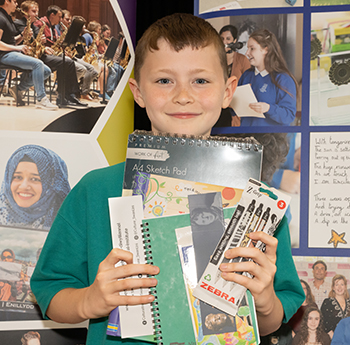 Rhys Cook holding his goody bag prizes