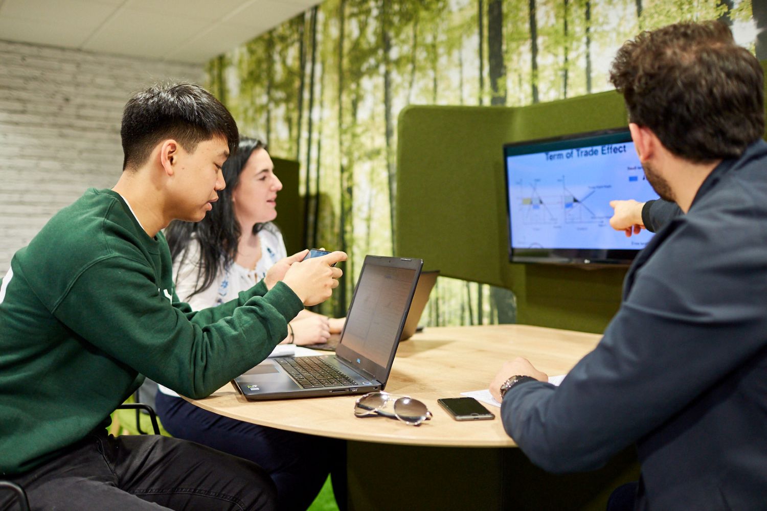 Student talking at a computer